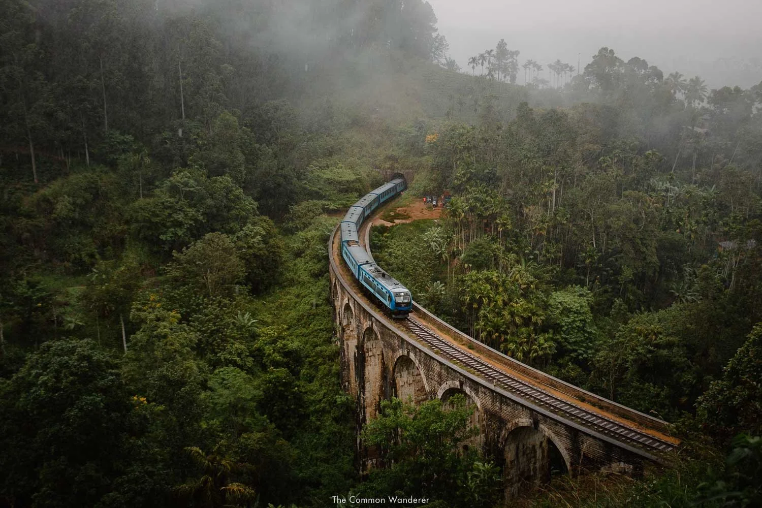 Scenic blue train crossing the Nine Arch Bridge in Ella highlands